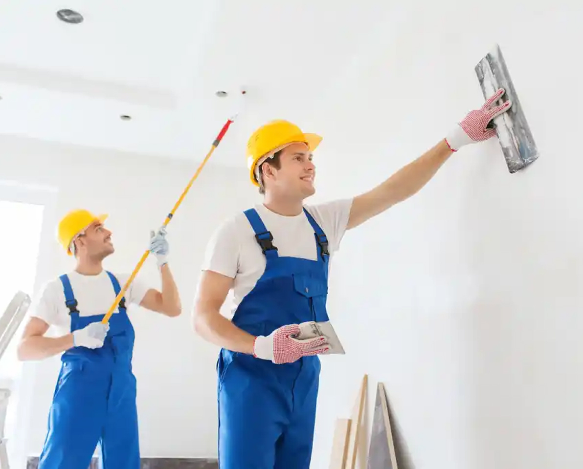 Painter working on a residential interior wall.
